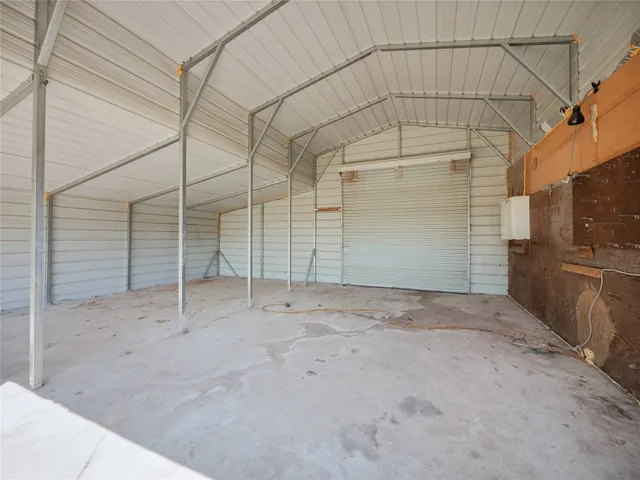 a view of a room with wooden walls