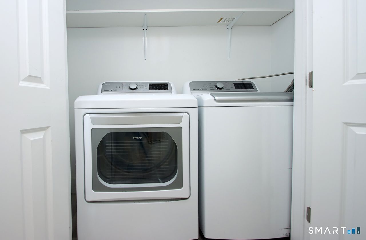 141 Duck Hole Road Madison, CT 06443 - Photo 11 of 22 a close up view of washer and dryer