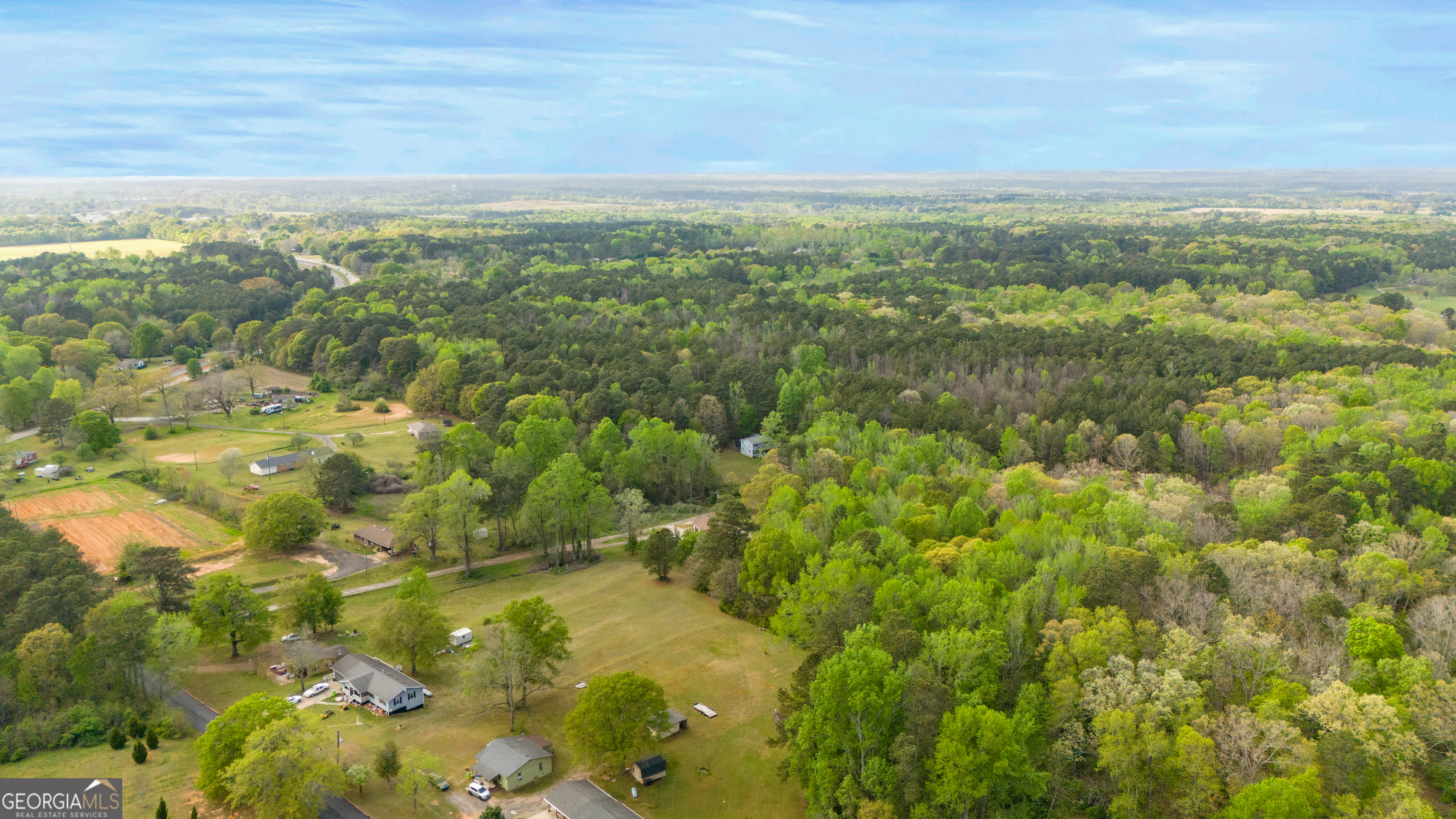555 Highway 3 North Hampton, GA 30228 - Photo 2 of 18 a view of a lake with a city