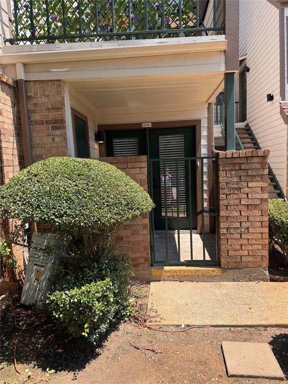 2305 Basil Drive, Unit D108 Arlington, TX 76006 - Photo 1 of 20 front view of a brick house with a small yard