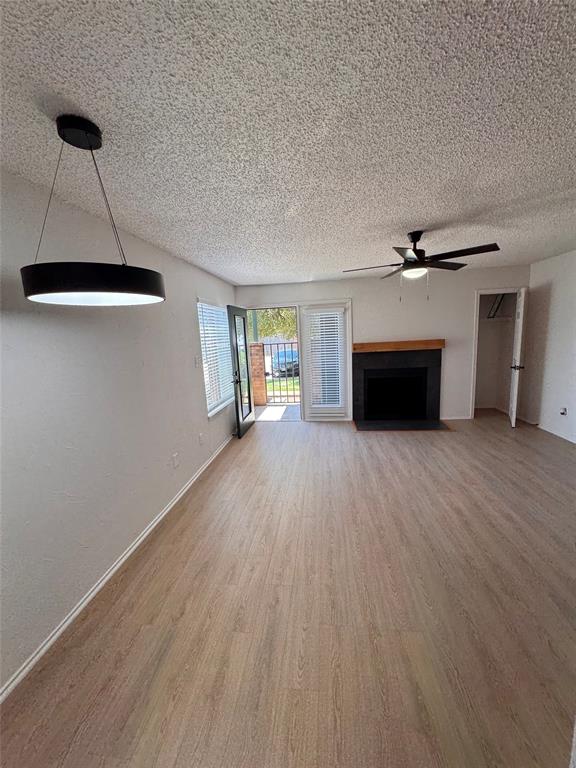 2305 Basil Drive, Unit D108 Arlington, TX 76006 - Photo 2 of 20 wooden floor in an empty room with a window