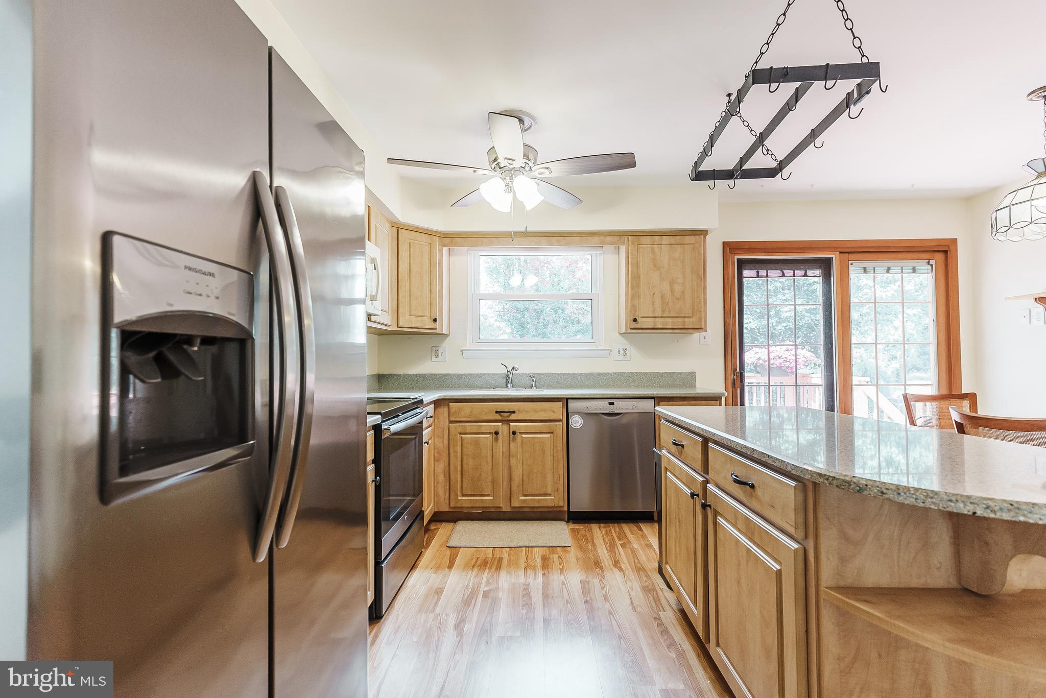 12 Victoria Court Mount Laurel, NJ 08054 - Photo 19 of 31 a kitchen with stainless steel appliances granite countertop a refrigerator a sink a stove and island