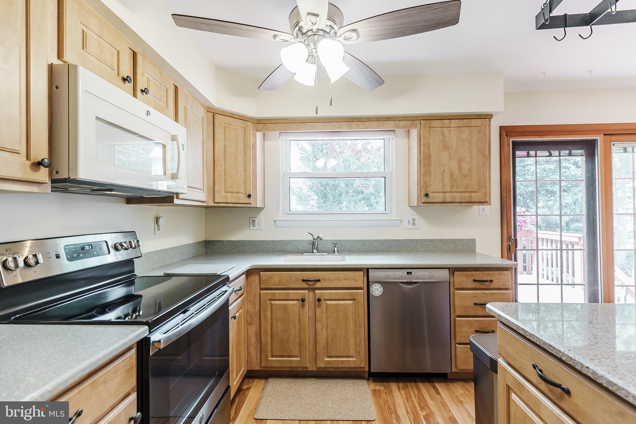 12 Victoria Court Mount Laurel, NJ 08054 - Photo 24 of 31 a kitchen with stainless steel appliances granite countertop a sink stove and cabinets