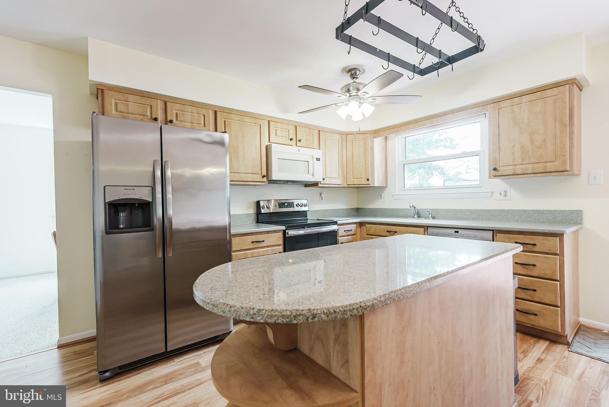 12 Victoria Court Mount Laurel, NJ 08054 - Photo 7 of 31 a kitchen with stainless steel appliances granite countertop a sink a stove a refrigerator cabinets and a dining table