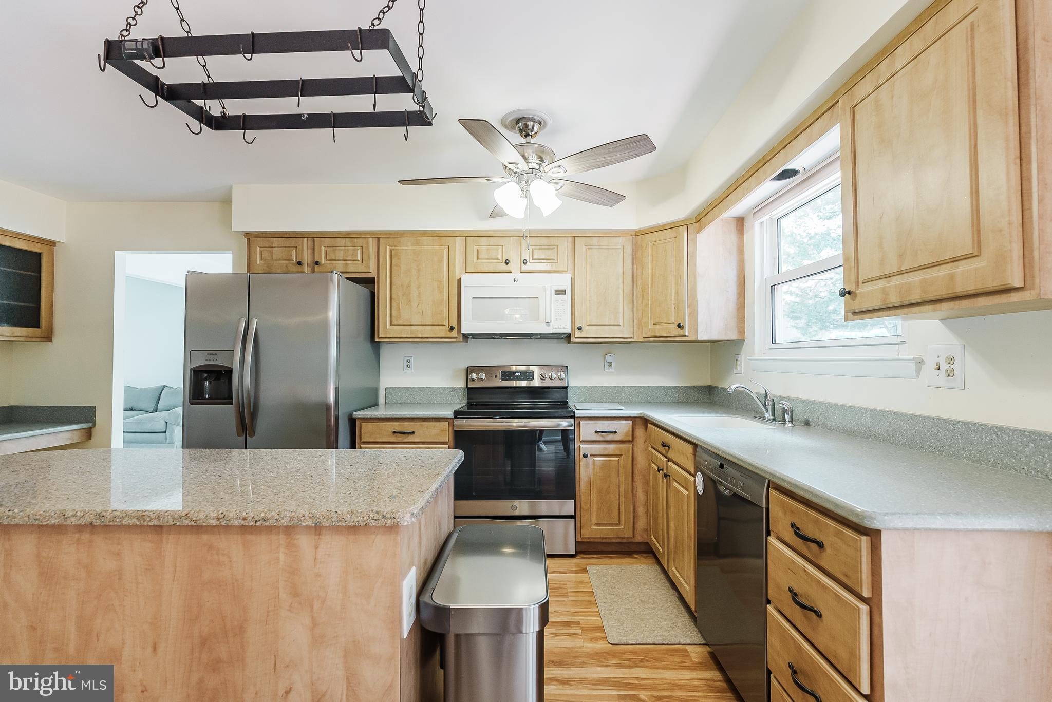 12 Victoria Court Mount Laurel, NJ 08054 - Photo 8 of 31 a kitchen with stainless steel appliances granite countertop a sink a stove and a refrigerator