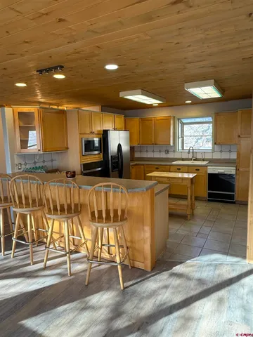 a kitchen with lots of counter top space and appliances