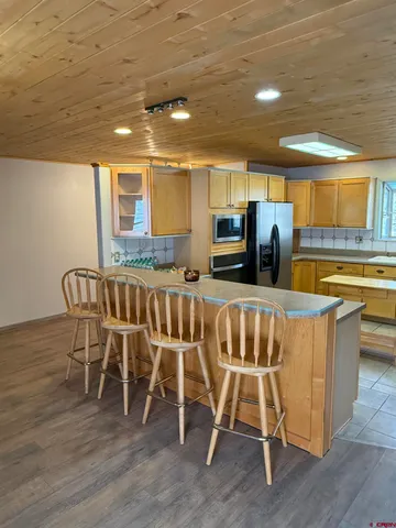 a dining room with furniture and chandelier