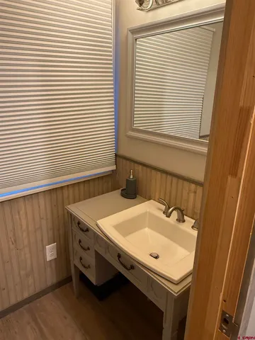 a bathroom with a sink and a window