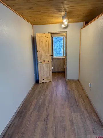a view of a livingroom with wooden floor