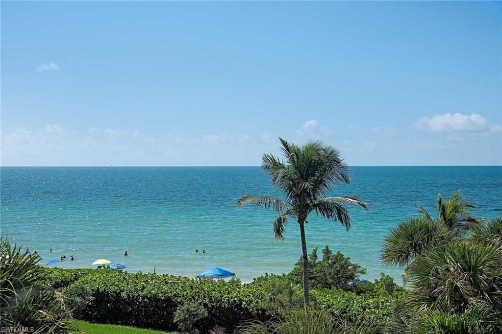 9155 Gulf Shore Drive, Unit 401 Naples, FL 34108 - Photo 1 of 12 a view of a lake