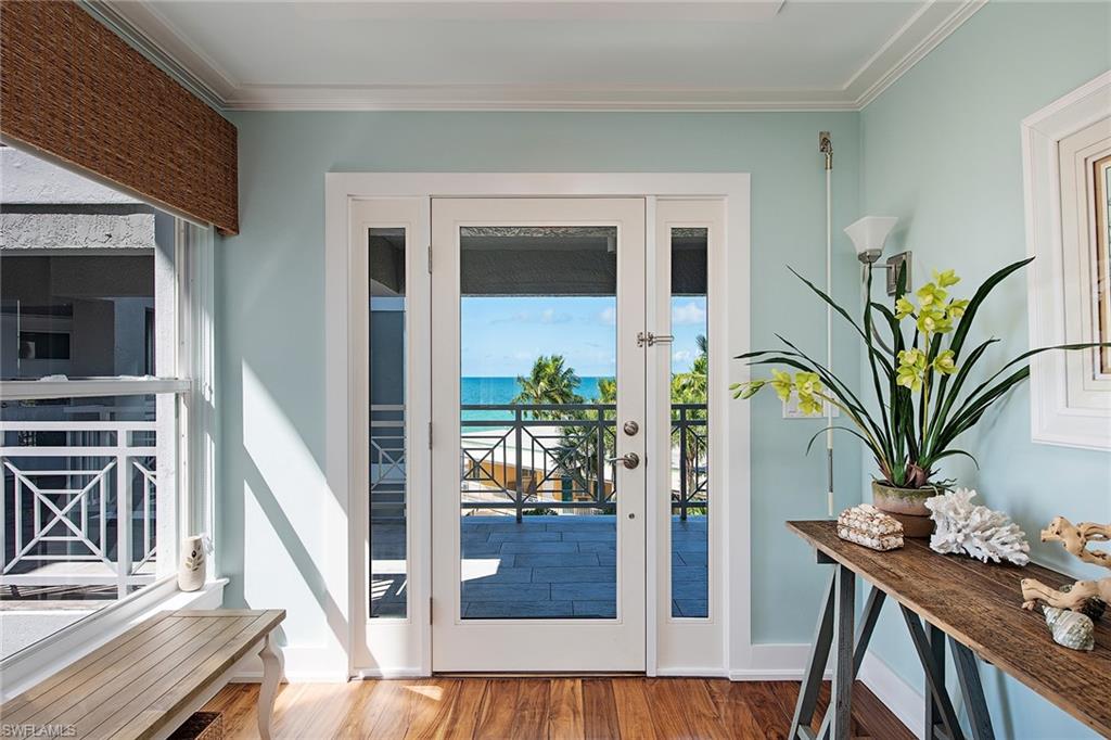 9155 Gulf Shore Drive, Unit 401 Naples, FL 34108 - Photo 3 of 12 a view of a hallway with furniture and entryway