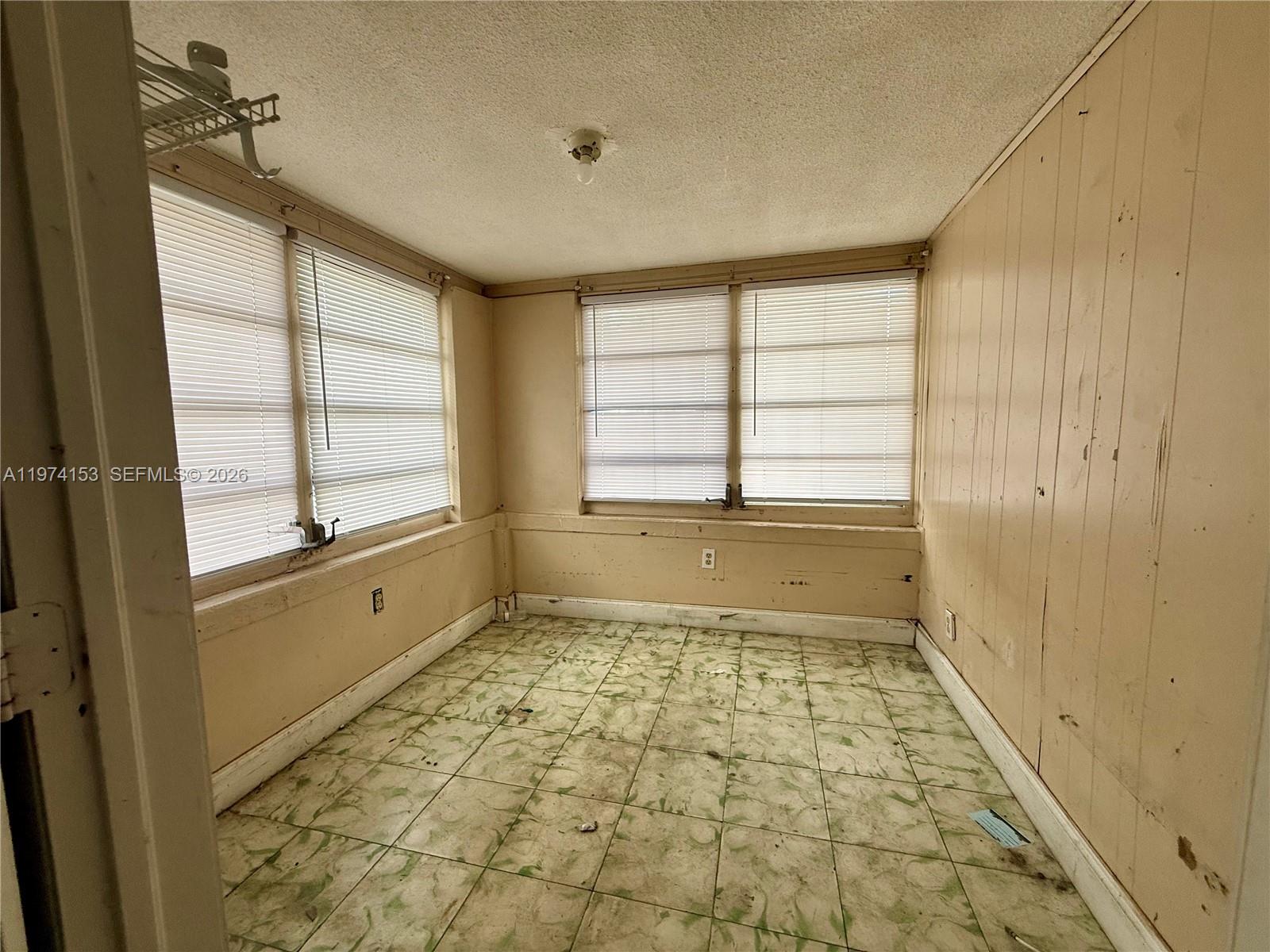 2228 Southwest 2nd Street Miami, FL 33135 - Photo 16 of 19 a bathroom with a bathtub and a shower