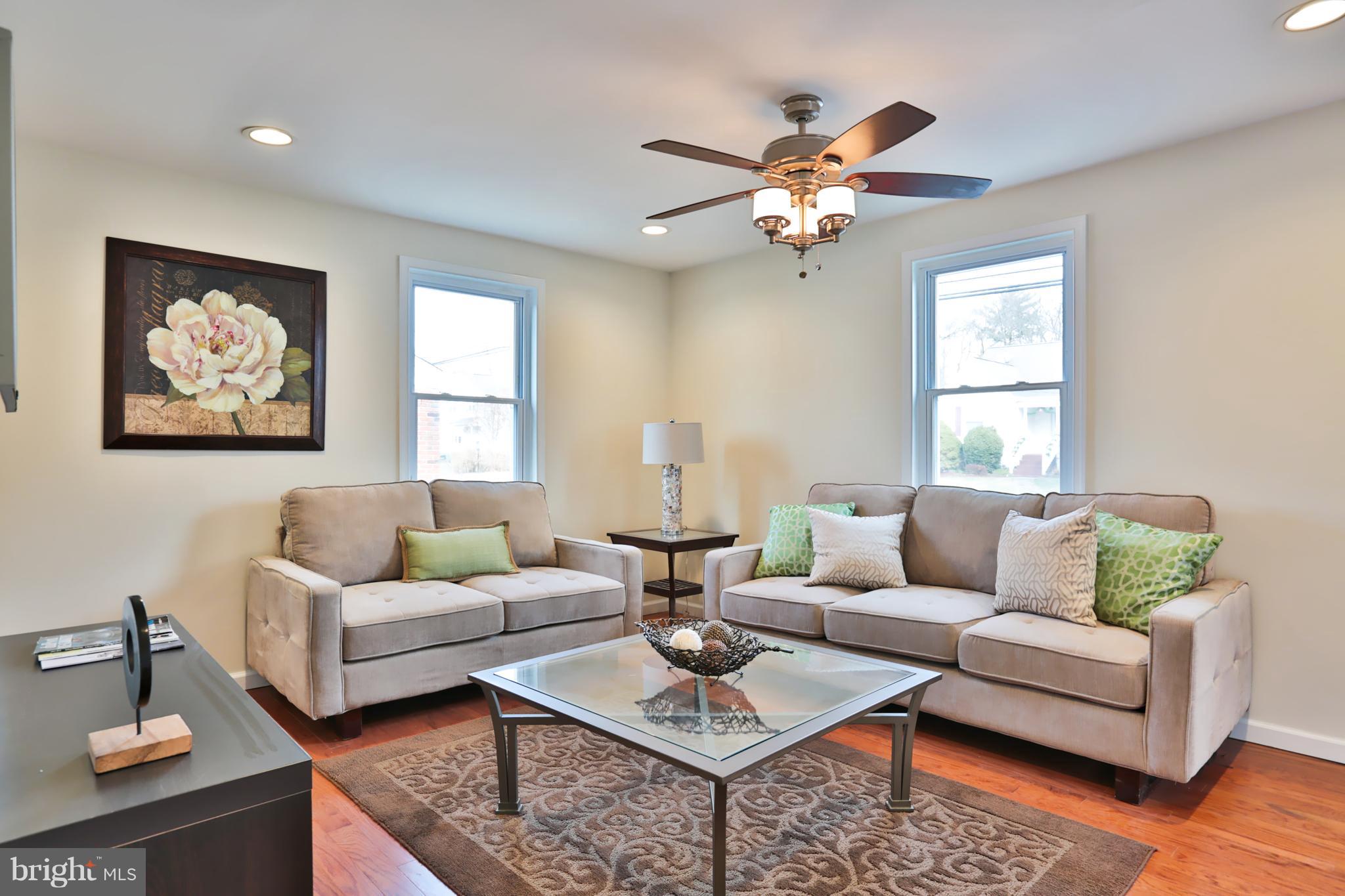 4115 Klausmier Road Baltimore, MD 21236 - Photo 2 of 30 a living room with furniture a chandelier and a window