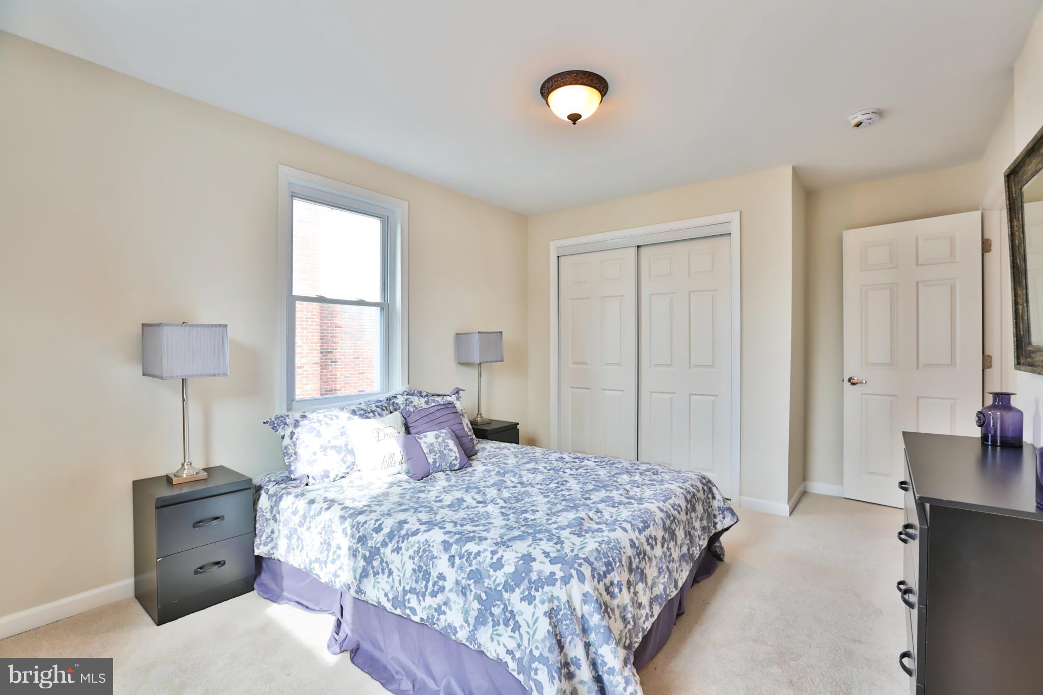 4115 Klausmier Road Baltimore, MD 21236 - Photo 16 of 30 a bedroom with a bed and a lamp