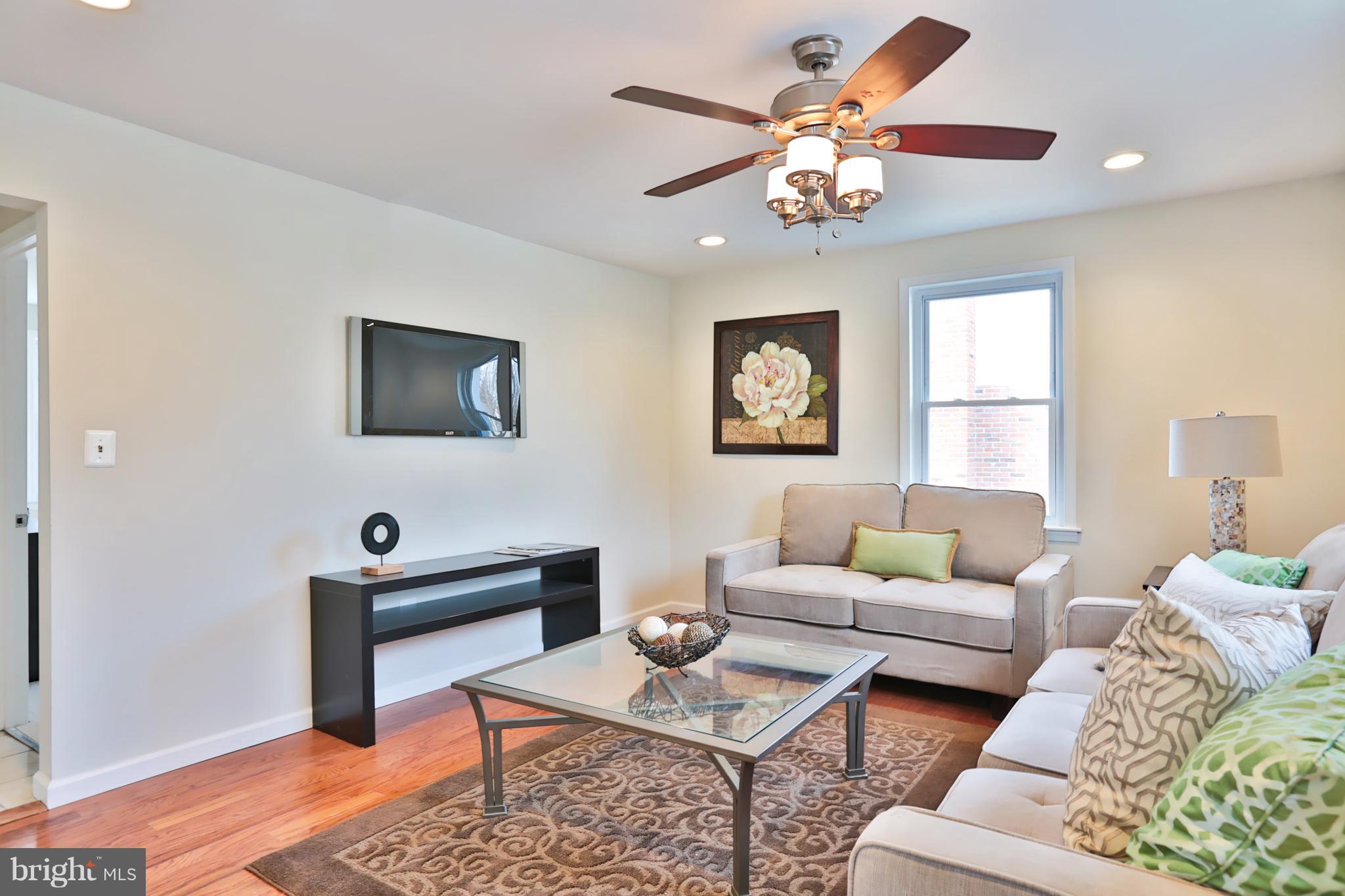 4115 Klausmier Road Baltimore, MD 21236 - Photo 3 of 30 a living room with furniture and a flat screen tv