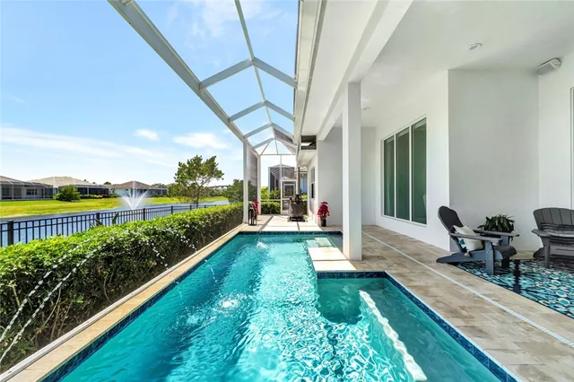 a view of a house with backyard and a tub