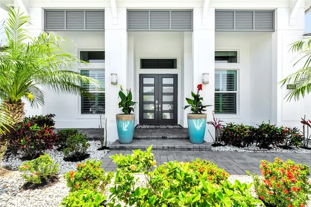 a view of a bunch of flowers in front of house