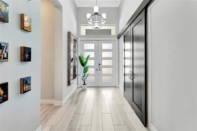 a view of a hallway view with wooden floor and staircase