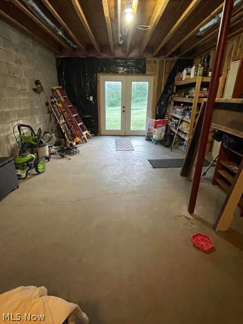 15393 Shade Road Guysville, OH 45735 - Photo 24 of 35 Concrete-floored lower level with exposed ceiling joists and block foundation walls