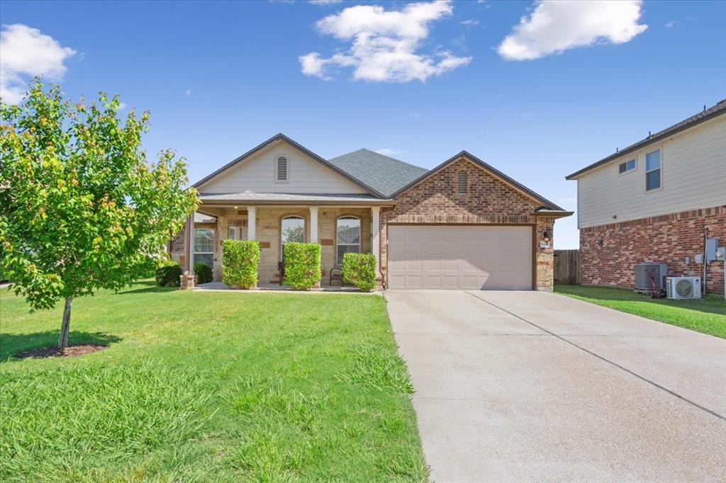 5308 Tama Drive Waco, TX 76708 - Photo 1 of 29 a front view of a house with a yard and garage