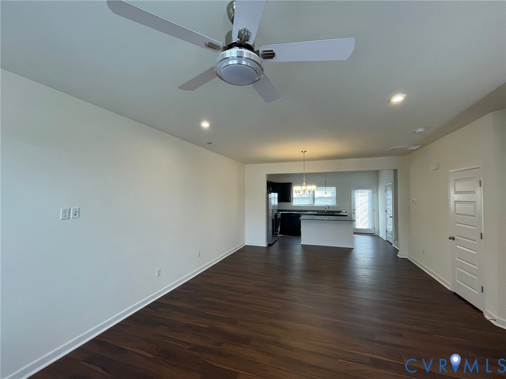 12201 Lightning Bug Loop Midlothian, VA 23112 - Photo 5 of 11 Spacious main living area featuring dark wood-fini