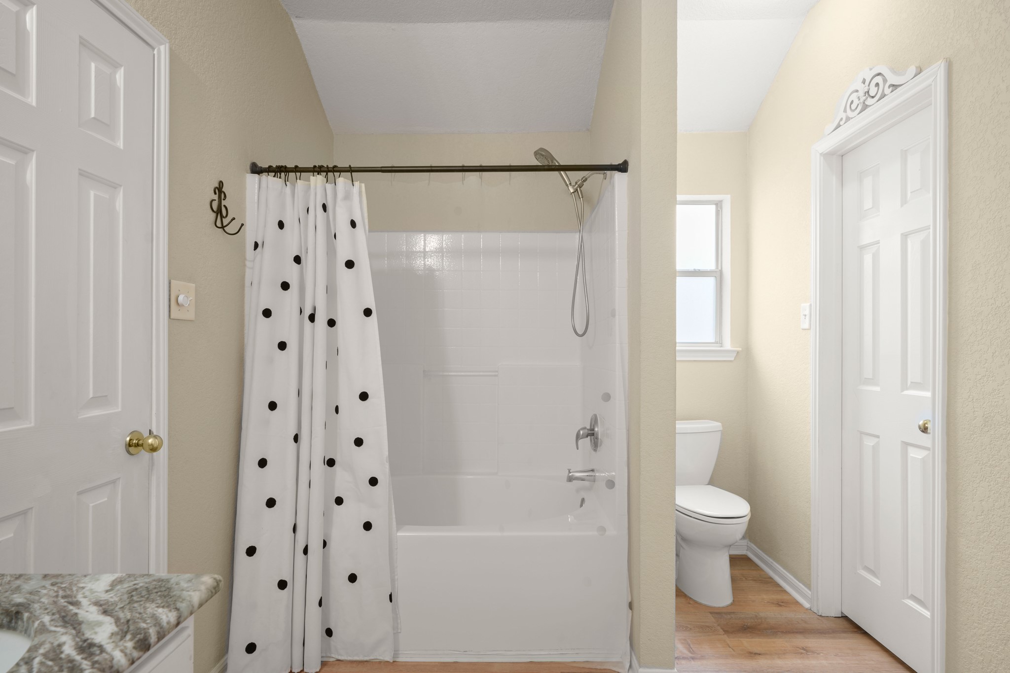438 Katy Crossing Georgetown, TX 78626 - Photo 14 of 24 Step into a clean and functional bathroom featuring a pristine bathtub and shower combination.