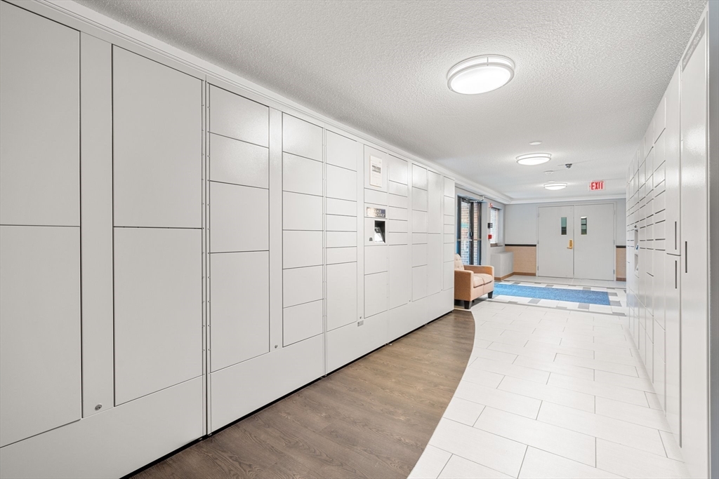 32 Whites Avenue, Unit E441 Watertown, MA 02472 - Photo 26 of 34 a view of a big room with closet area