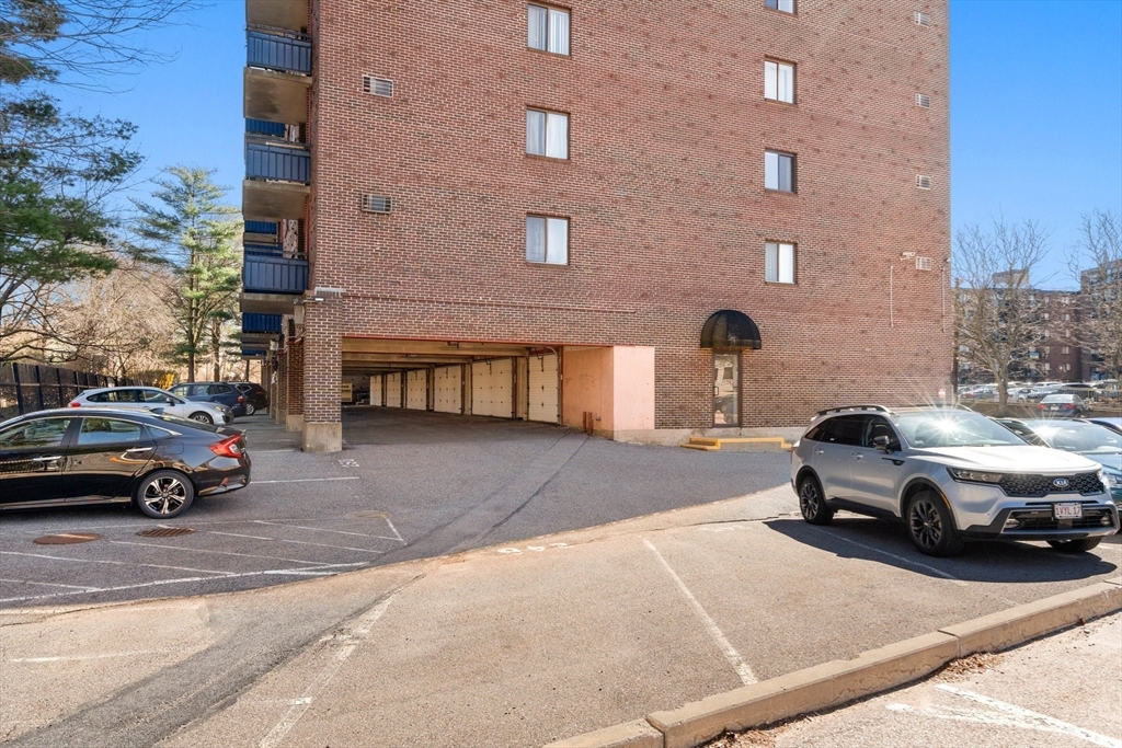32 Whites Avenue, Unit E441 Watertown, MA 02472 - Photo 31 of 34 a car parked in front of a building