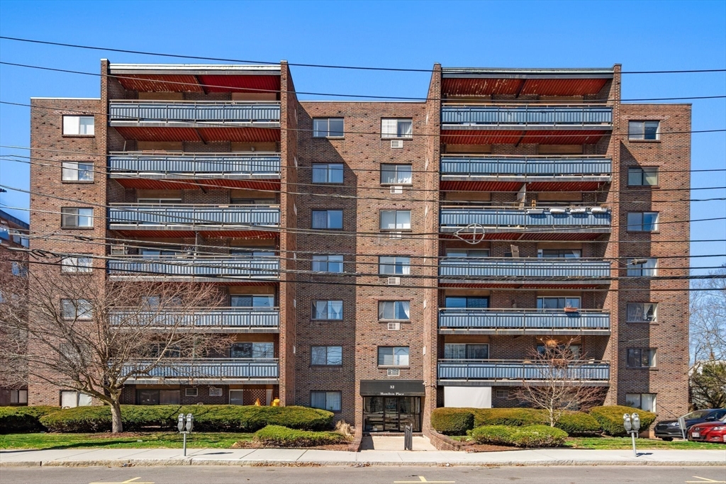 32 Whites Avenue, Unit E441 Watertown, MA 02472 - Photo 33 of 34 a front view of a building with street view