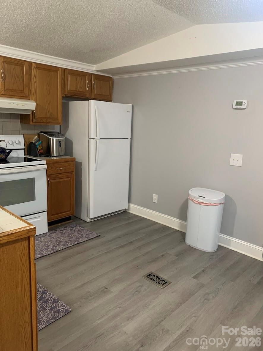 2595 Southmont Road Iron Station, NC 28080 - Photo 4 of 10 a view of a kitchen with a sink stove and refrigerator
