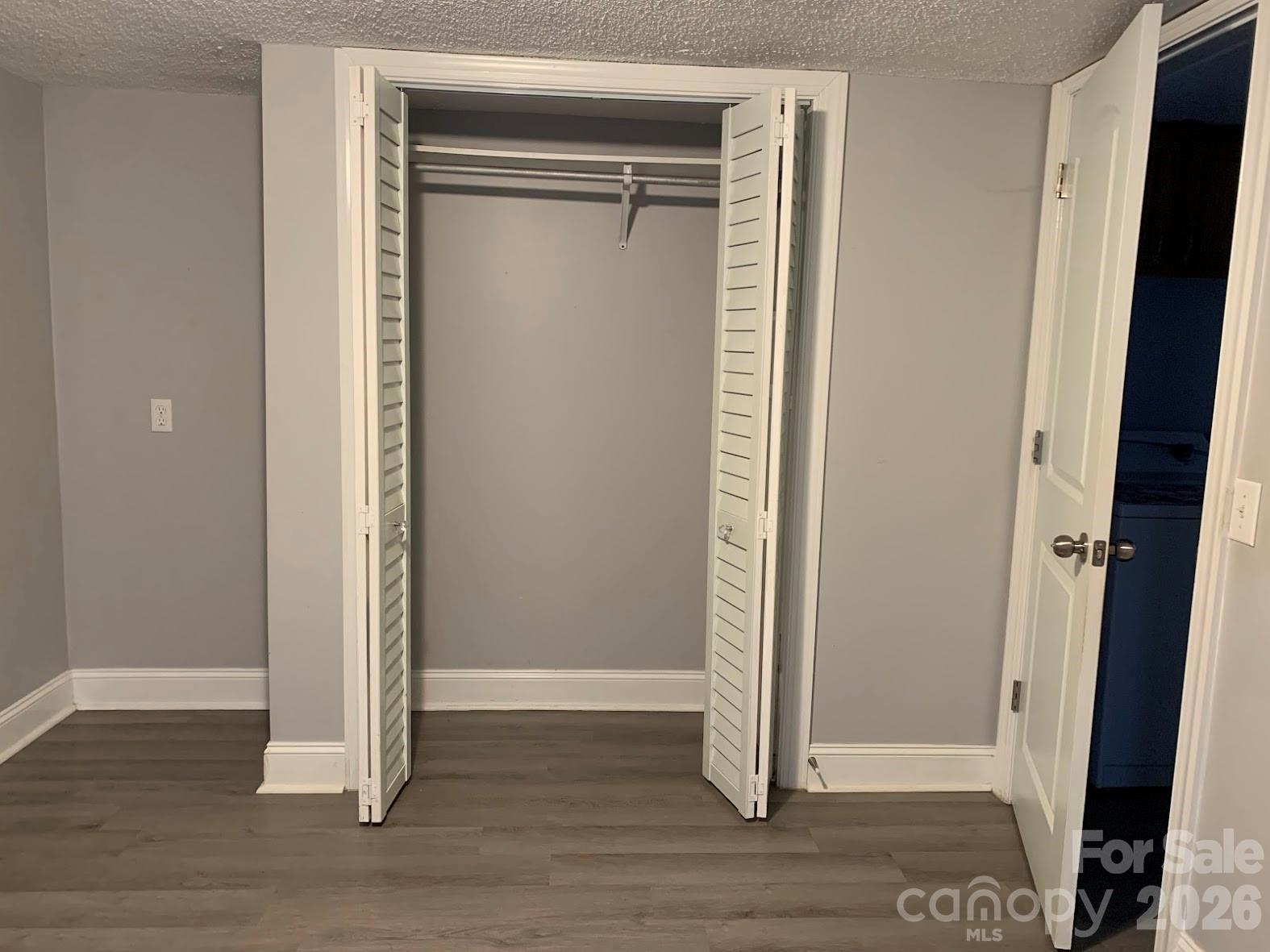 2595 Southmont Road Iron Station, NC 28080 - Photo 6 of 10 an empty room with wooden floor and closet