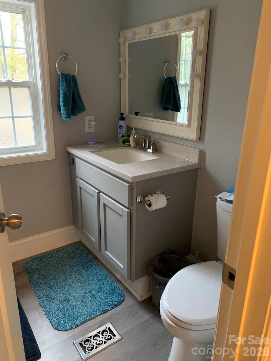2595 Southmont Road Iron Station, NC 28080 - Photo 7 of 10 a bathroom with a sink toilet and mirror