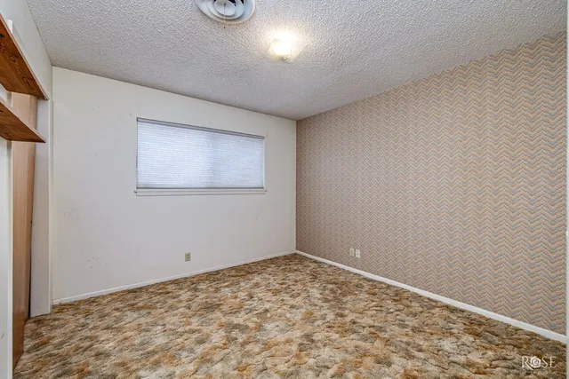 a view of a room with shelf and closet