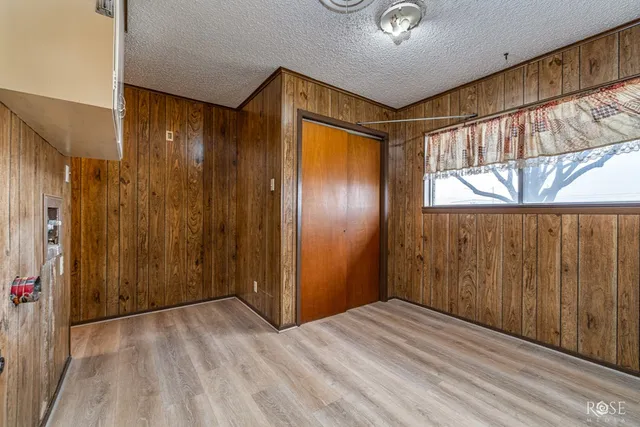 a view of hallway with wooden floor