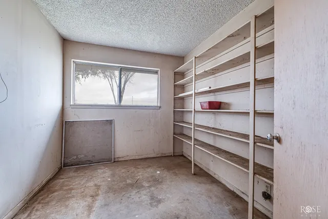 a view of a room with wooden walls