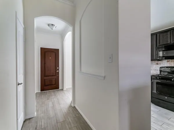 a view of a kitchen from the hallway