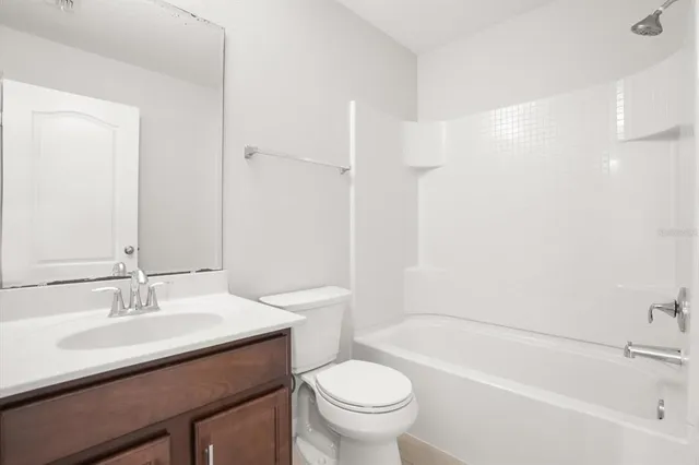 a bathroom with a sink a toilet and a bathtub