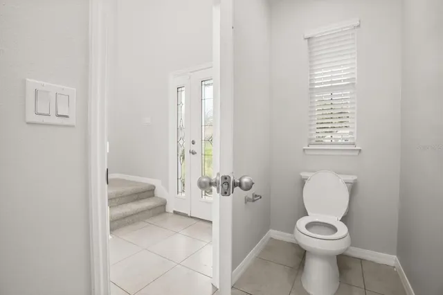 a bathroom with a toilet sink and tub