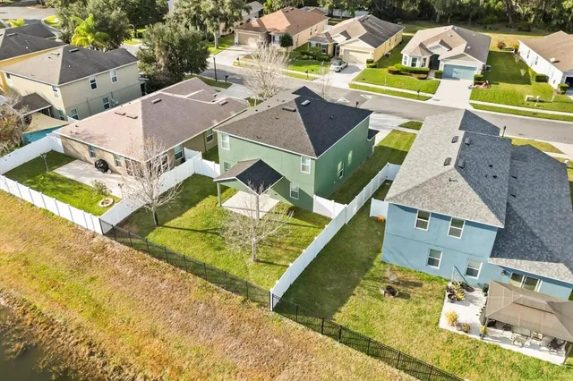 an aerial view of a house with a swimming pool
