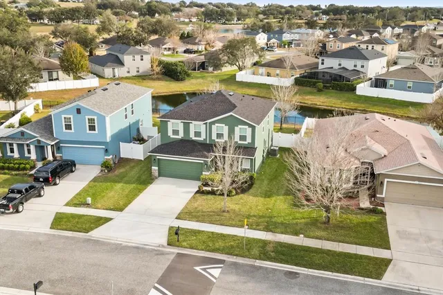 an aerial view of a house with a swimming pool