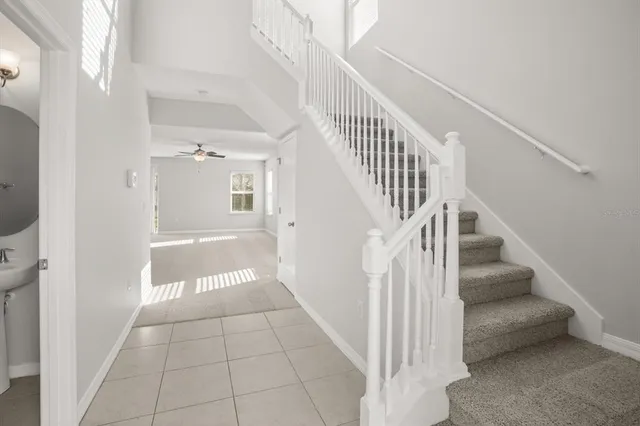 a view of an entryway with wooden floor