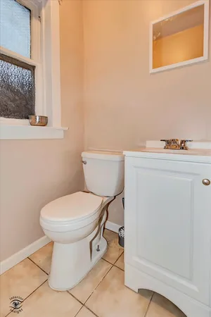 a bathroom with a toilet and a sink