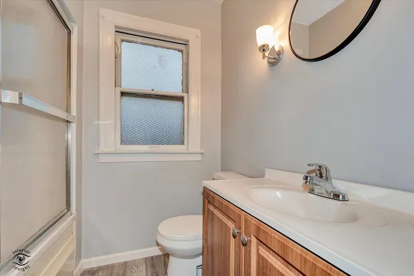 a bathroom with a sink toilet and vanity