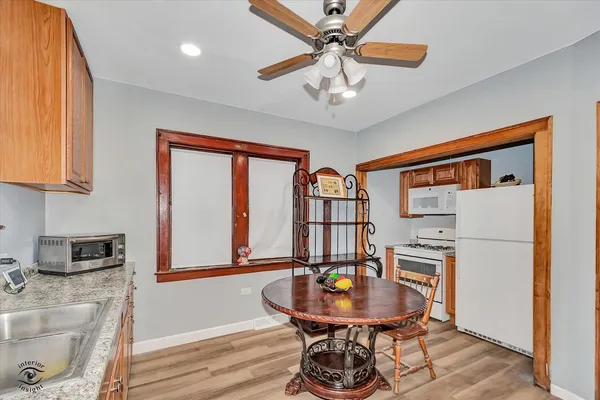 a dining room with furniture and window