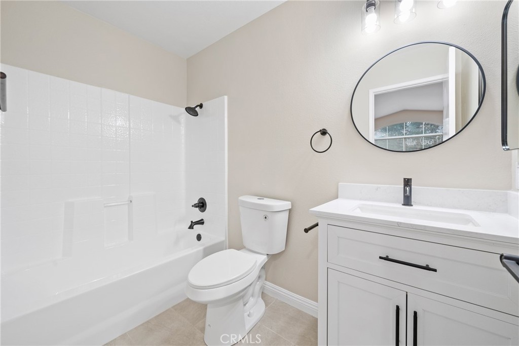 219 Chaumont Circle Lake Forest, CA 92610 - Photo 20 of 56 The ensuite bathroom features a resurfaced shower and a white shaker vanity.