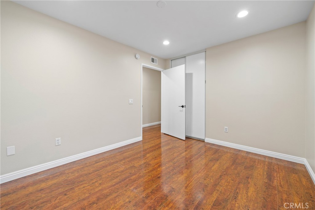 219 Chaumont Circle Lake Forest, CA 92610 - Photo 23 of 56 Well-lit rooms with laminate flooring and stylish finishes throughout.