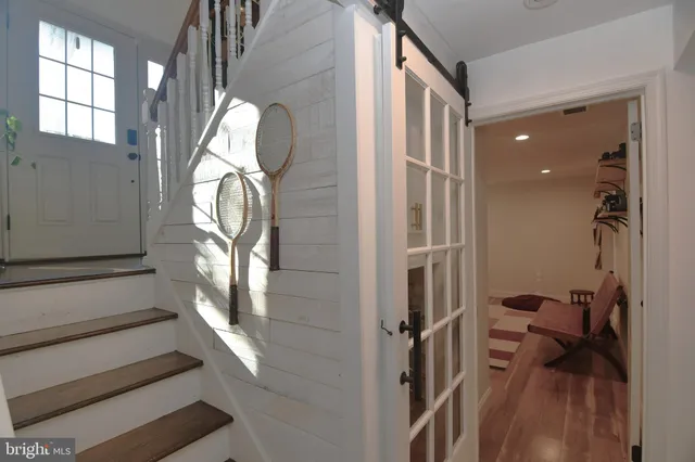 a view of staircase with white walls and windows