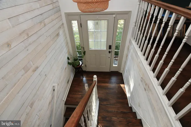 a view of a balcony with wooden floor and stairs