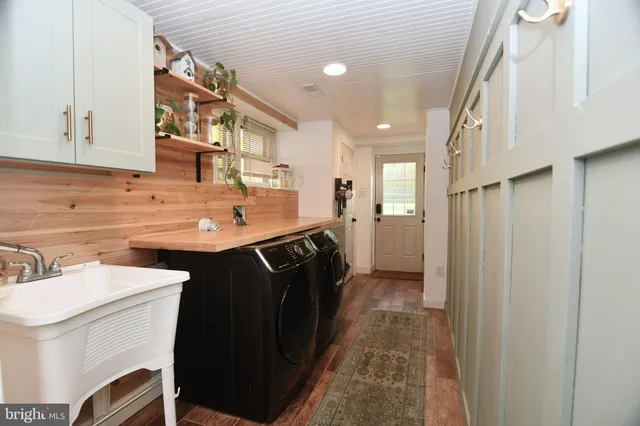 a kitchen with a sink refrigerator and a sink