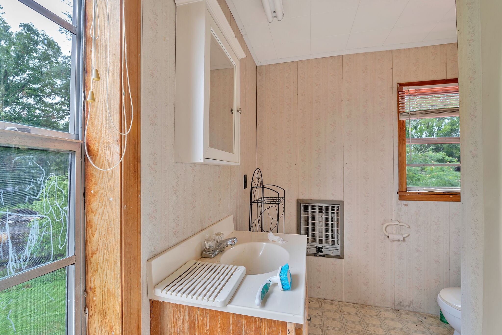 1205 Main Street Altamont, TN 37301 - Photo 24 of 51 a bath room with a sink and a window